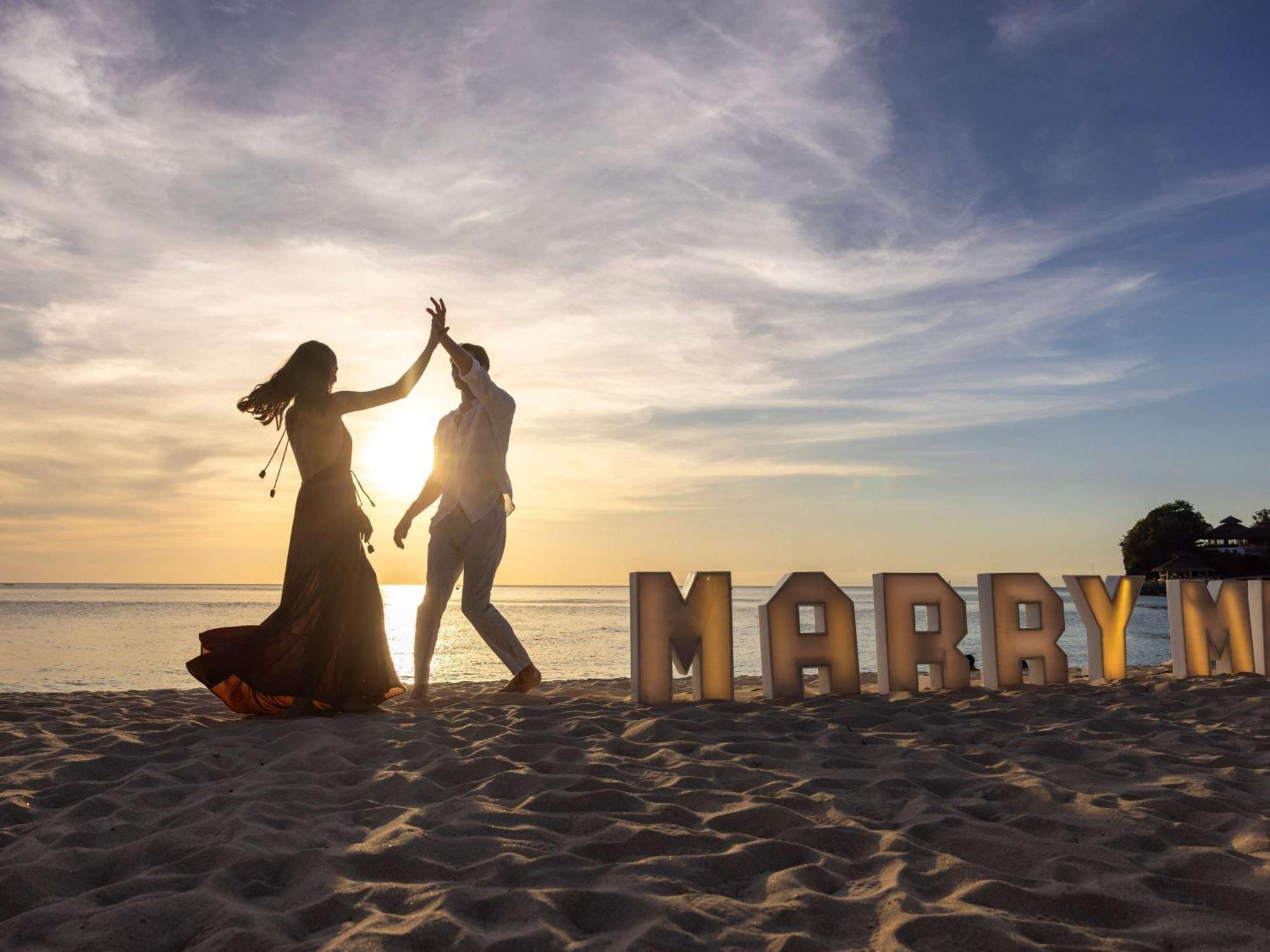 Movenpick Resort & Spa Boracay Yapak Exterior photo A newly married couple on a beach